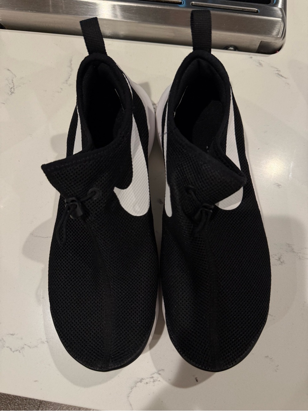 Nike Black Slip-On Sneakers with White Swoosh